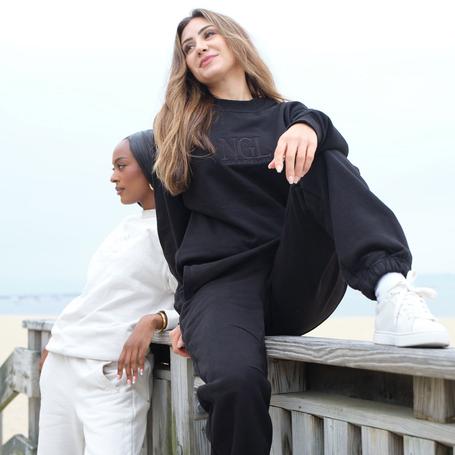models wearing black cotton crewneck sweatshirt and black joggers in small - Nice Girls Label