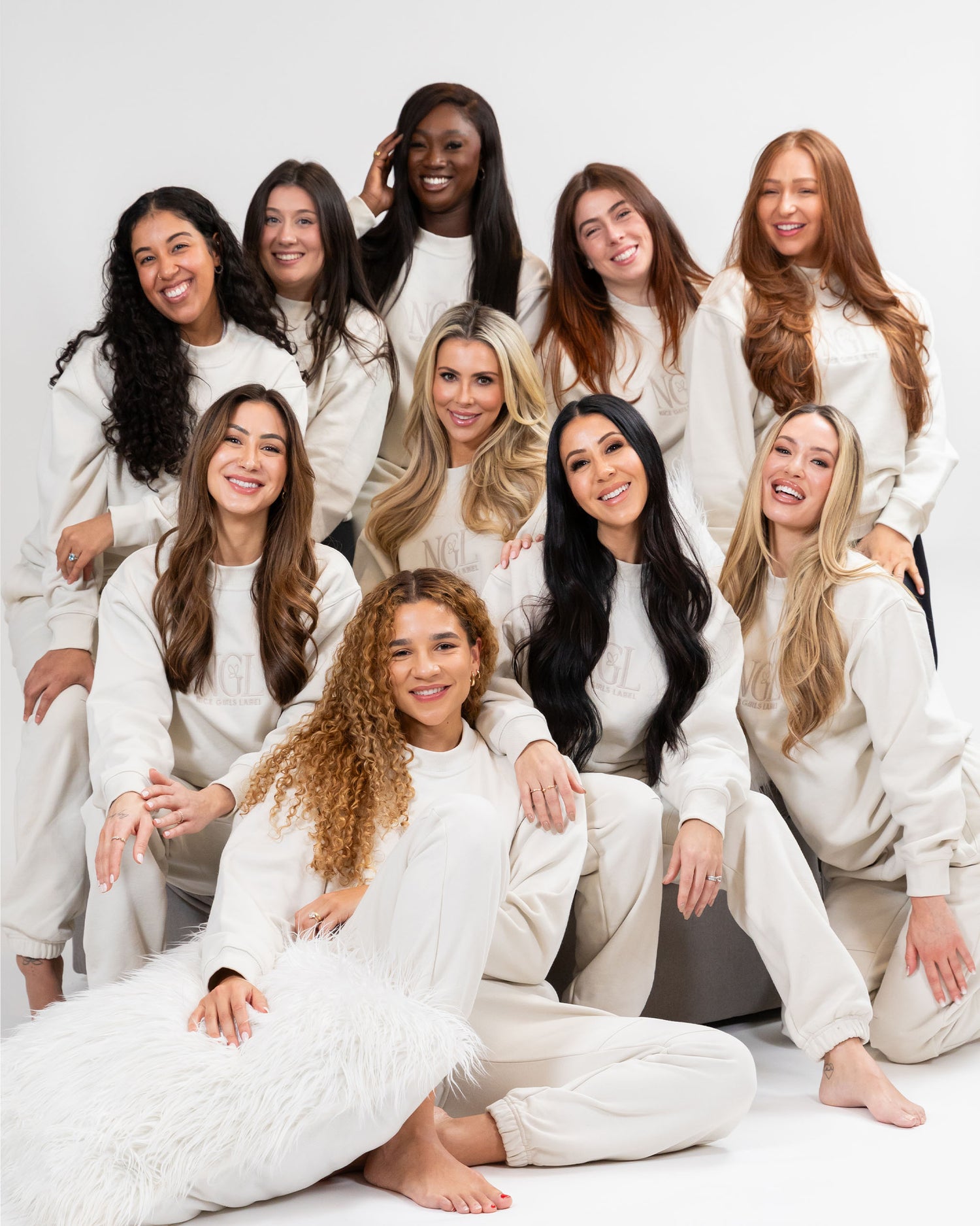 group of models wearing Nice Girls Label stone crewneck and jogger set