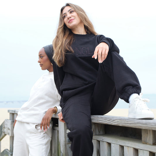 models wearing black cotton crewneck sweatshirt and black joggers in small - Nice Girls Label